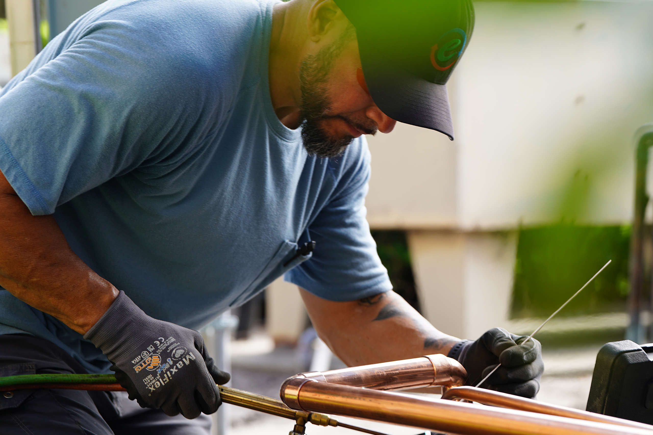 An Efficient Air HVAC Technician Installs A Commercial-Grade System.